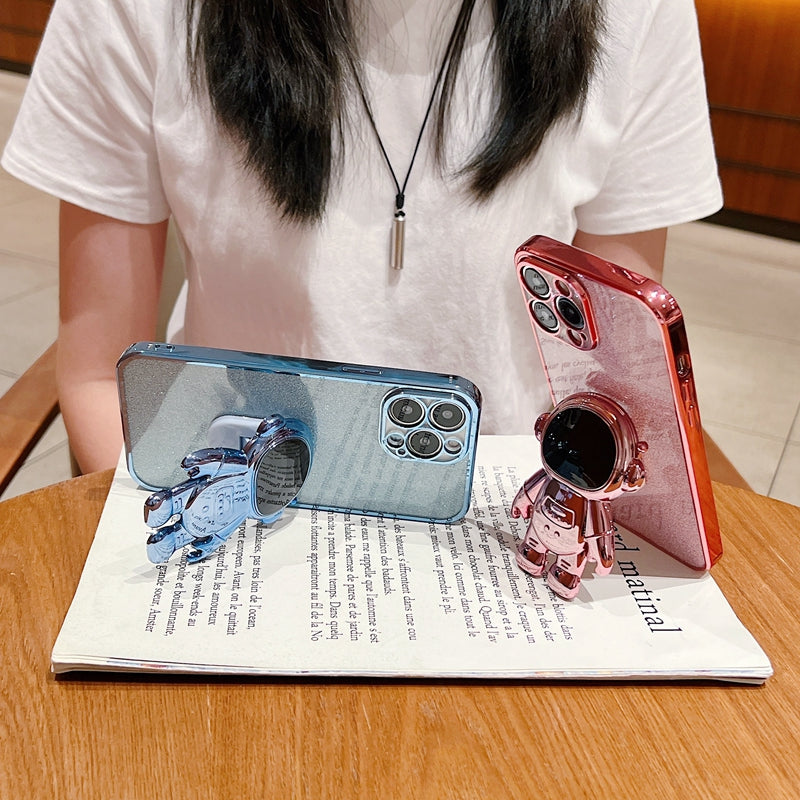 Luxus-Glitzer-Astronauten-Falt-Silikonhülle mit Ständer und Handhalterung für Apple iPhone 17/17 Air, 16/16e, 15, 14, 13 Pro Max Plus | Stoßfest, wasserabweisend & fingerabdruckfrei