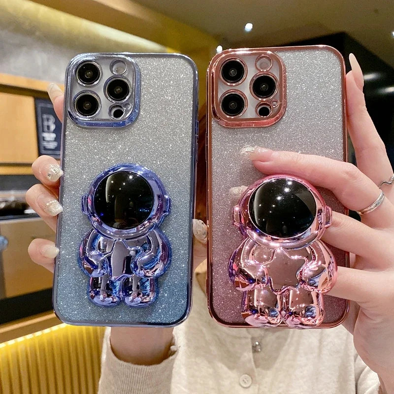 Luxury Glitter Astronaut Folding Silicone Case with Stand and Hand Holder for Apple iPhone 16/15/14/13/12 Pro Max Plus Mini | Shockproof, Water-Resistant & Anti-Fingerprint